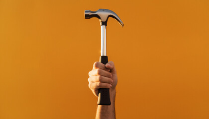 Hand Gripping Metal Hammer Against Solid Orange Background, Lifestyle Shot, High Contrast, Close-Up View