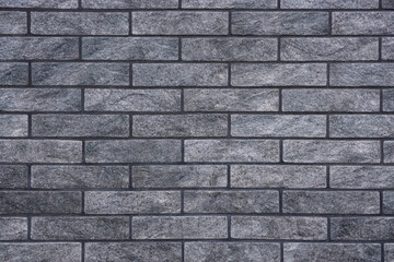 Texture of grey brick wall as background, closeup