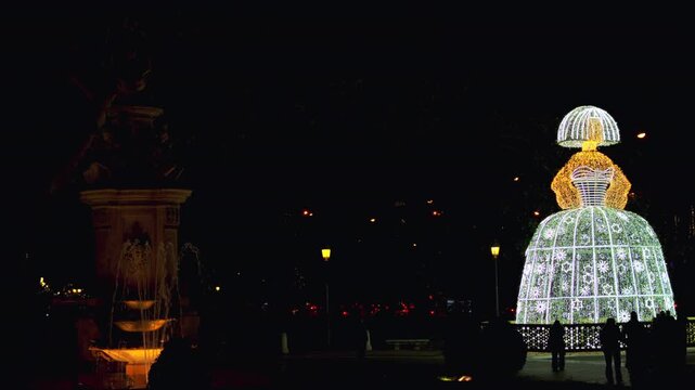 Madrid, Spain - December 30, 2025: Christmas lights Menina sculpture in Madrid