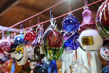Colored hand painted glass balls for Christmas tree decoration at a Christmas market.