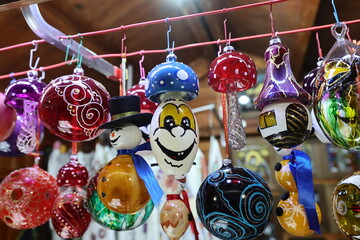 Colored hand painted glass balls for Christmas tree decoration at a Christmas market.