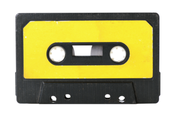 Old yellow cassette tape with music tracks from the past isolated on white background.