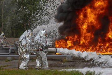 Firefighters use a foam generator to supply foam to extinguish the fire. A fire at the plant caused...