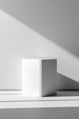 Fototapeta premium White cube on a white surface with shadows