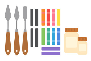 Flat lay of professional painting equipment including palette knives, colorful pigment sticks, and art paste