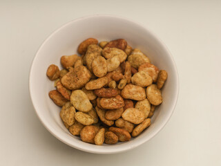 Bowl of Koro beans or jack beans on white background
