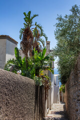 Alleyway on Amalfi coast in summer day. Way to the sea.