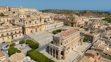 Fototapeta premium Aerial view of the historic center of the city of Noto, in the province of Syracuse, Sicily, Italy. At the center of the town is the historic center with the Cathedral of San Nicolò and the Town Hall.