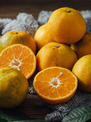Fresh Oranges and Slices on Wooden Table with Natural Textures