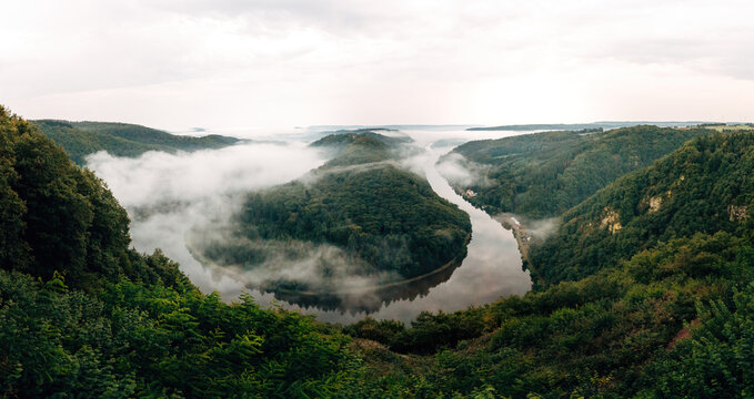 Scenic Aerial View of Saarschleife River Bend in Morning Mist, Famous German Landscape with Foggy Valley