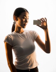 Beautiful Asian Woman Holding Blank Business Card Mockup