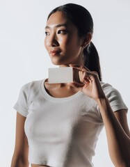 Beautiful Asian Woman Holding Blank Business Card Mockup