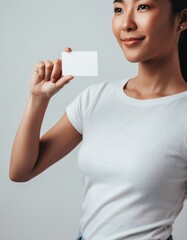 Beautiful Asian Woman Holding Blank Business Card Mockup