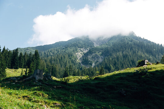 panoramic view of high mountains during a summer hike, sunny alpine landscape and outdoor adventure concept, getty, sommer
