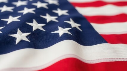 Obraz premium Close-up of American flag fabric with stars and stripes.