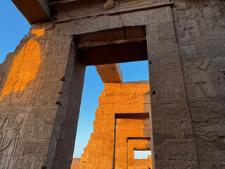 Sunset on old stone wall in temple of Kom Ombo Egypt