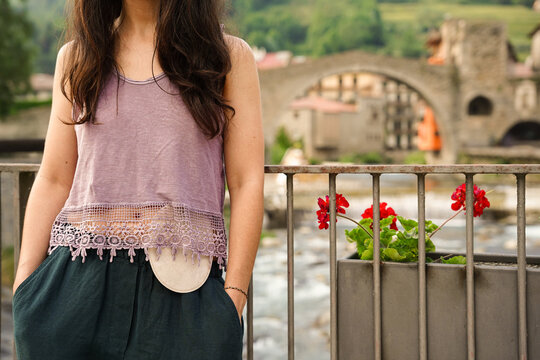 unrecognizable woman with ostomy bag. World Cancer Day