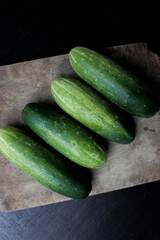 fresh cucumbers on a wooden table