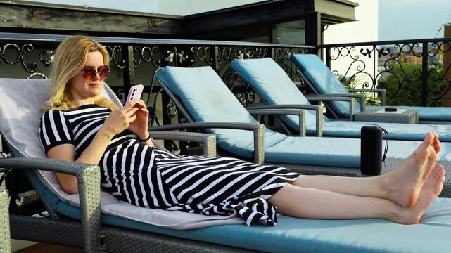 Rooftop music moment with girl and bluetooth speaker