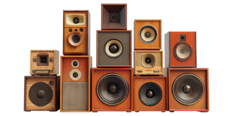 Pile of vintage speakers stacked in collection concept. Collection of vintage speakers in varied sizes and designs.