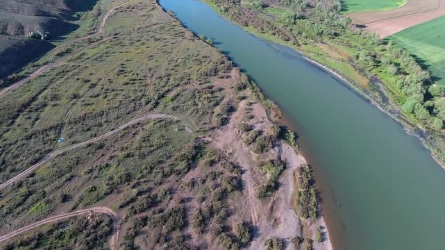 Aerial view of still waters of the Yenisei Angara and Selenga rivers across Siberia. Calm freshwater surfaces reveal vast river geography linking Russia and Mongolia in Central Asia.