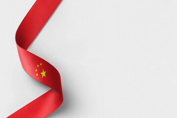 China flag ribbon on white background with copy space