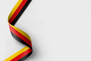 Germany flag ribbon on white background with copy space