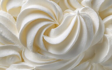 Swirled white frosting in a close-up, revealing layers and texture