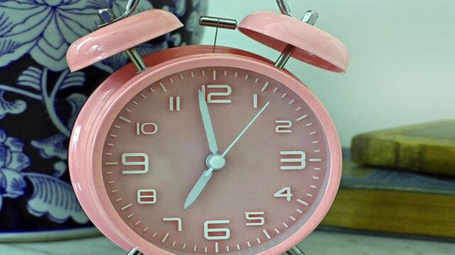 Time standing still at 7am, pink, alarm clock