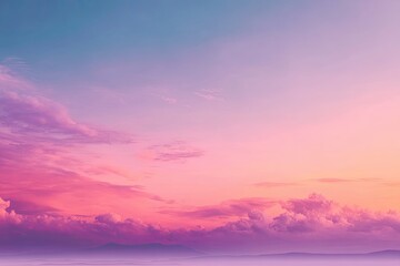 Obraz premium A vibrant sunset sky with hues of pink, purple, and blue, over a distant mountain range