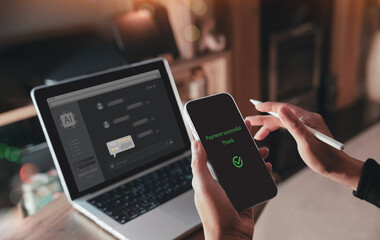 Close up of woman completing mobile payment with confirmation screen while interacting with AI chatbot on laptop, representing digital finance, smart transaction, and customer support technology