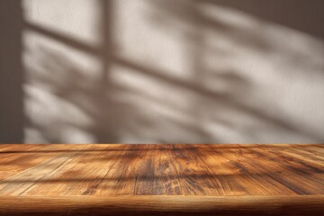 Wooden table surface with window shadows