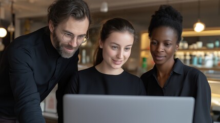 A vibrant executive team gathers around a laptop, excitedly discussing their project plan. The atmosphere is filled with enthusiasm and creativity, highlighting teamwork and innovation