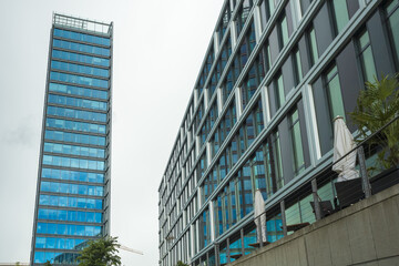 View of modern architecture showcases towering glass buildings reflecting the sky, embodying a blend of urban sophistication and sleek design, Bremen, Bremen, Germany.