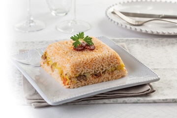 Baked rice with chorizo ​​and sausage stuffing with seasonal vegetables.