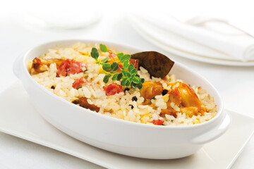 Baked rice with wild rabbit and black pepper.