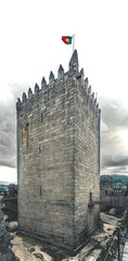 Main Tower of Guimar&atilde;es Castle with Portuguese Flag