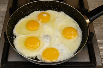 Five-Egg Omelette Frying in a Pan on a Stove