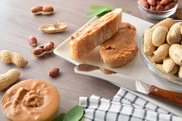 Delicious natural peanut butter spread on slices of bread