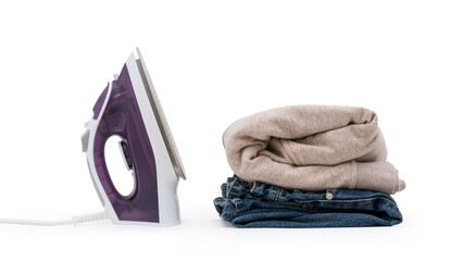 purple electric iron placed and filter the folded cloth on isolated white background