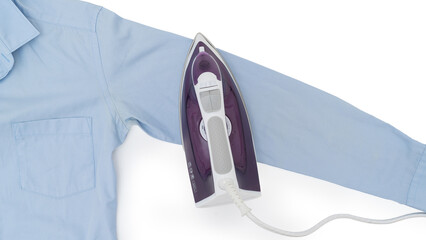 Top view of a purple electric iron placed on a light blue shirt while ironing