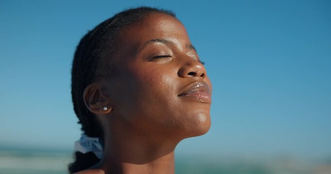 Beach, eyes closed and black woman with vacation, calm and travel with wellness. Seaside, tourism and African person with summer holiday, peaceful and breathing with weekend trip, face and break