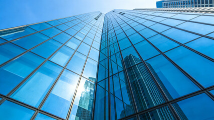 Modern Glass Curtain Wall Architecture: Blue Reflective Facade of Urban Skyscrapers
