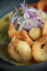 Corvina ceviche with smooth ají cream, crispy panko shrimp, and sweet potato—an elegant fusion of textures and bold Peruvian flavors.