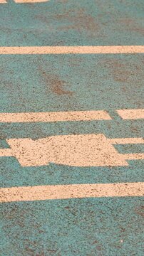 Electric charging sign painted on parking spot for electric vehicles alternative energy concept