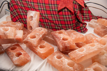 Amman, Jordan - December 08, 2024: Himalayan salt candle holders displayed at a holiday market