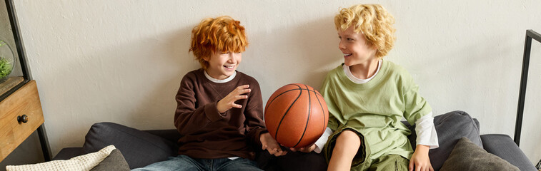 Joyful moments shared by boys in a modern apartment with a basketball