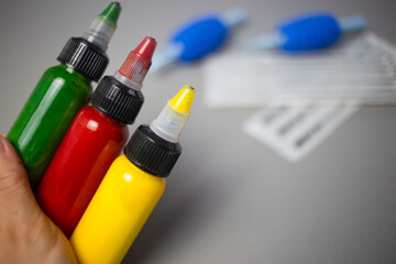 Tattoo ink yellow, red and green