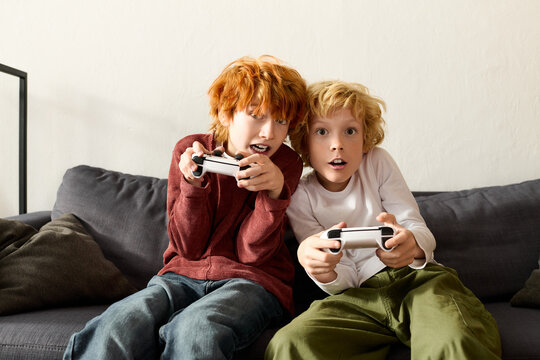 Exciting gaming adventures of gen alpha boys in a cozy modern apartment together
