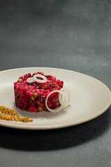 Classic Russian Beet Salad with Mustard Seeds on Plate. Vinaigrette